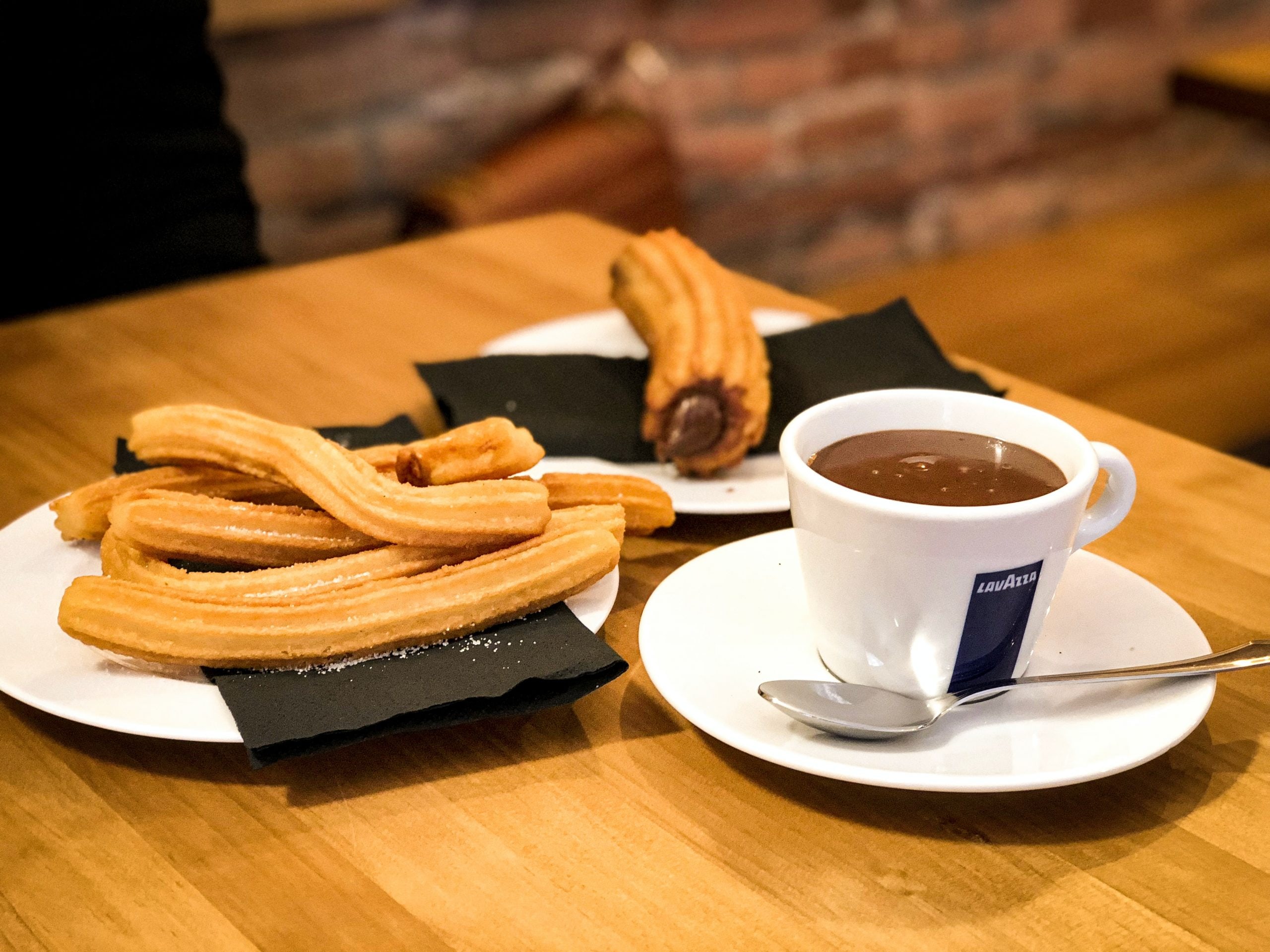 Originally invented by Spanish shepherds who could easily cook them in a pan over an open fire, today these elongated, crispy, crunchy, cinnamon sugar sprinkled twists are most commonly eaten in Spain and Latin America as a hot breakfast food, accompanied by a strong cup of coffee or a cup of thick hot chocolate. 