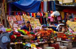 Vendor selling bags in a street market, New Delhi, India Stock