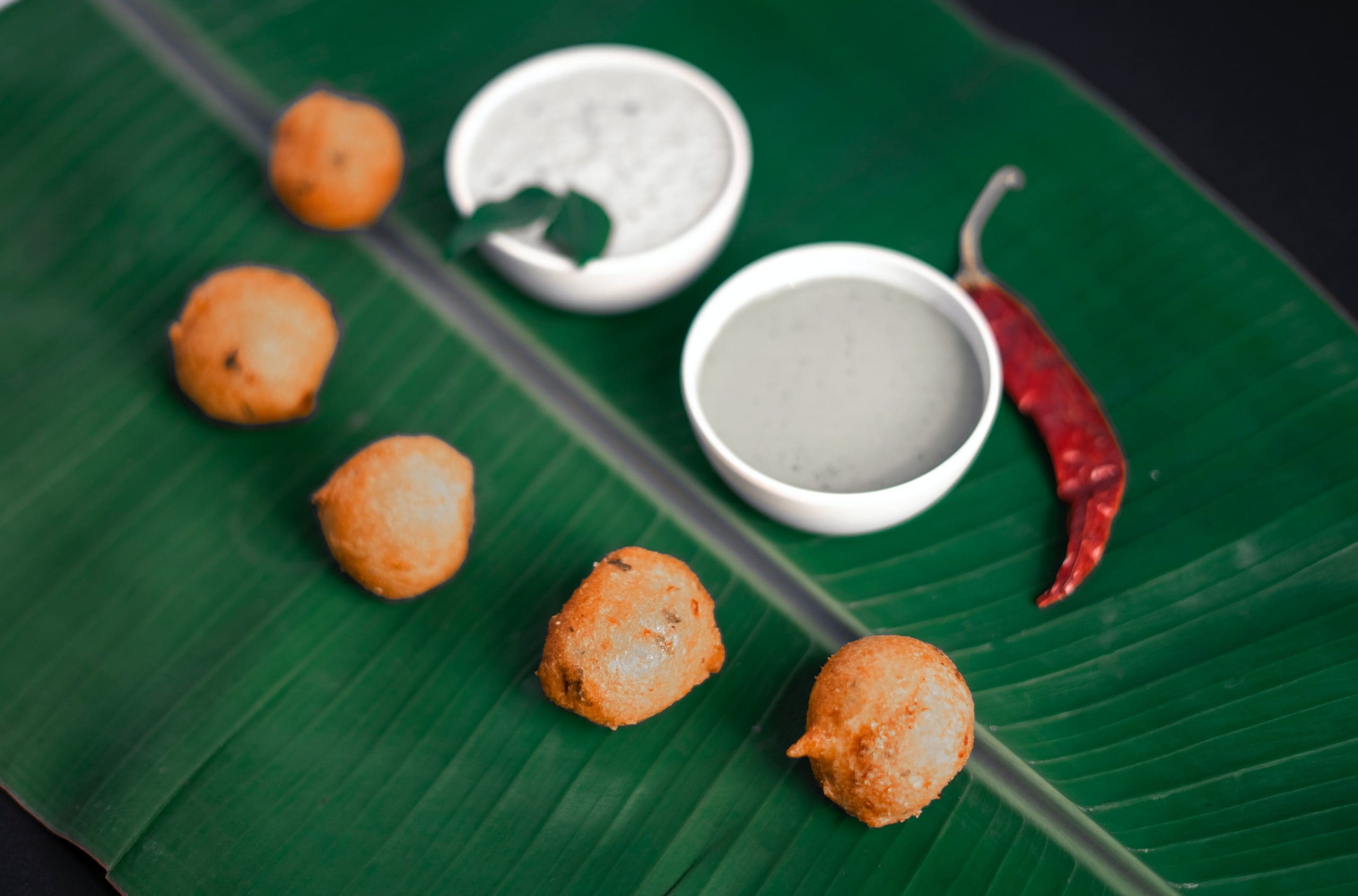 Which of these cuisines is traditionally served on a banana leaf?